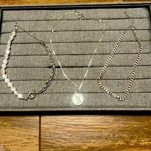 Three silver necklaces to wear as a combo. Stack all three together.